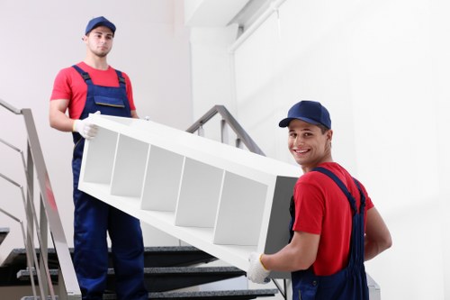 Furniture collection team handling bulky household items in Roehampton