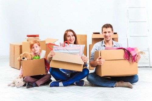 Careful loading of household items for a Roehampton apartment relocation