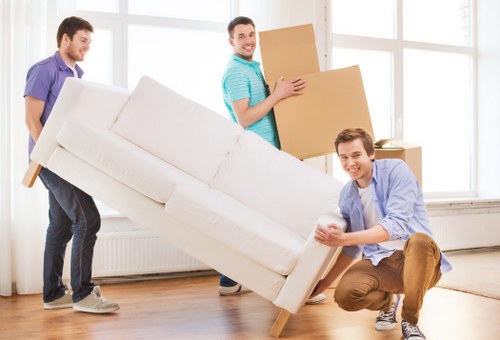 Packed boxes and furniture ready for a local move in Roehampton