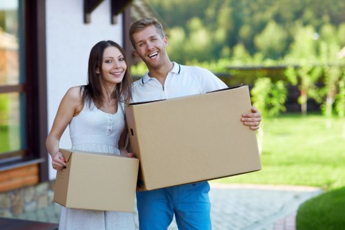 Professional movers handling boxes during a Roehampton relocation
