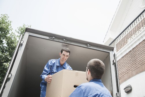 Shared house move with boxes and luggage prepared for transport in Roehampton